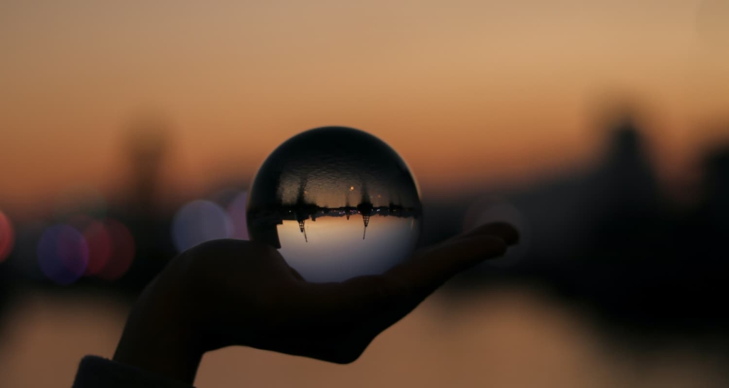 Person holding a crystal ball - Analysis